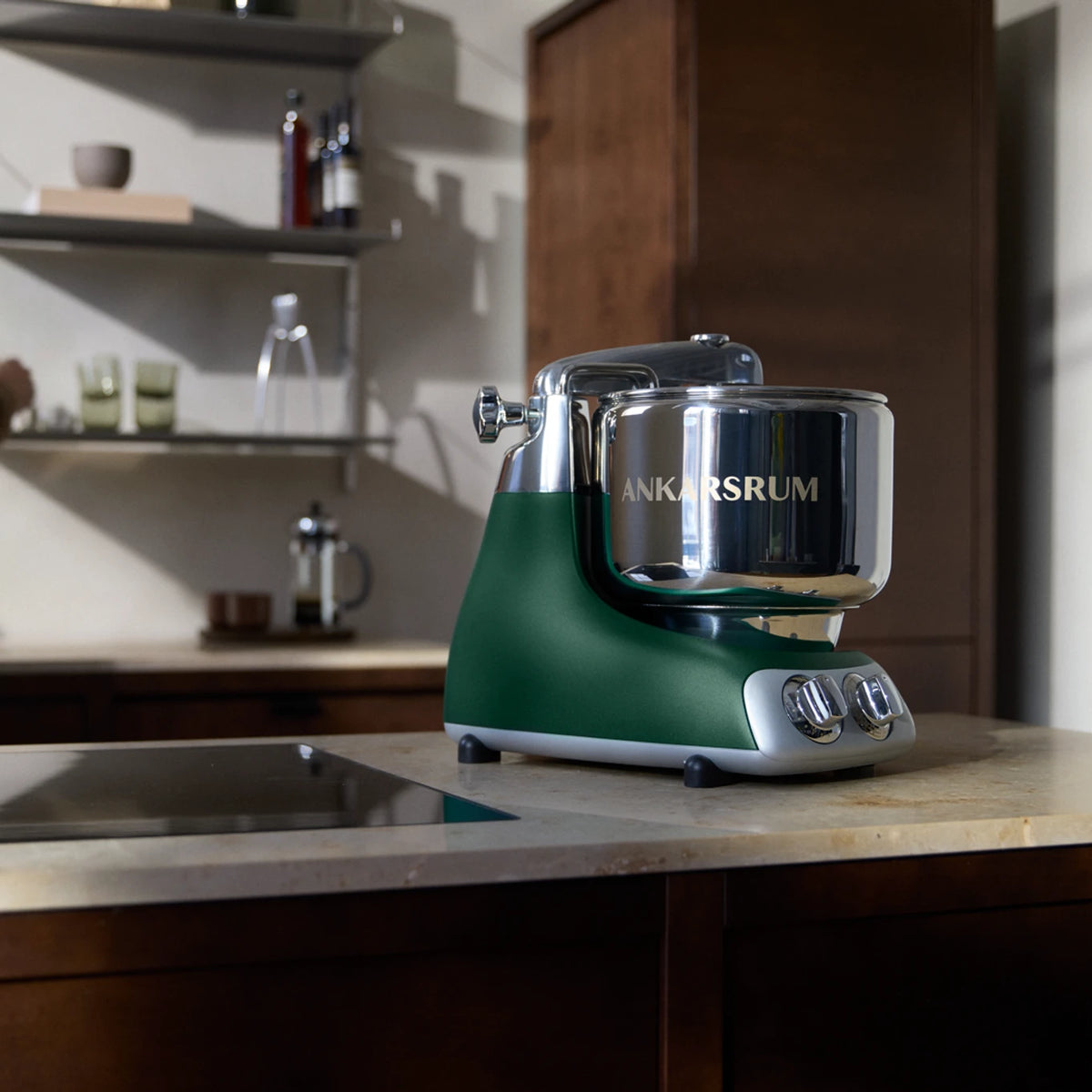 Ankarsrum Assistent Original Stand Mixer – Forest Green, in a styled product photograph.